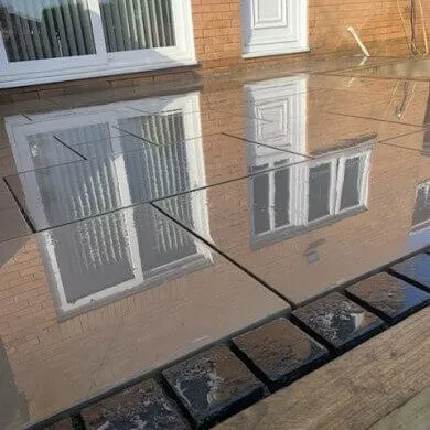 Large stone patio, reflecting house