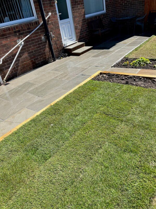 11 stone patio and landscaped garden with block edging