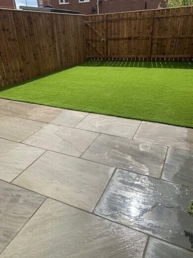 15 landscaped grass and natural stone patio