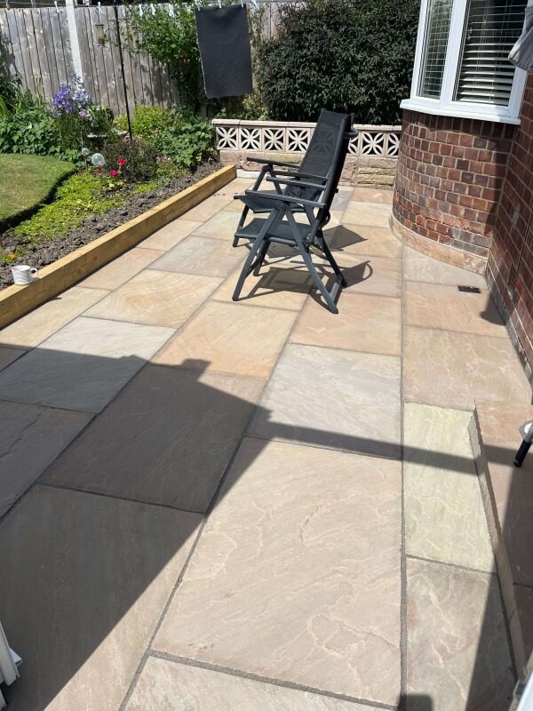 16 sandstone slab patio with garden furniture
