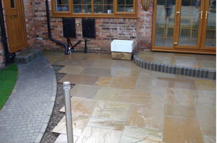 31 large sandstone slab patio with block paving pathway